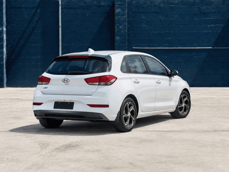 2022 Hyundai i30 in White, rear three-quarter view