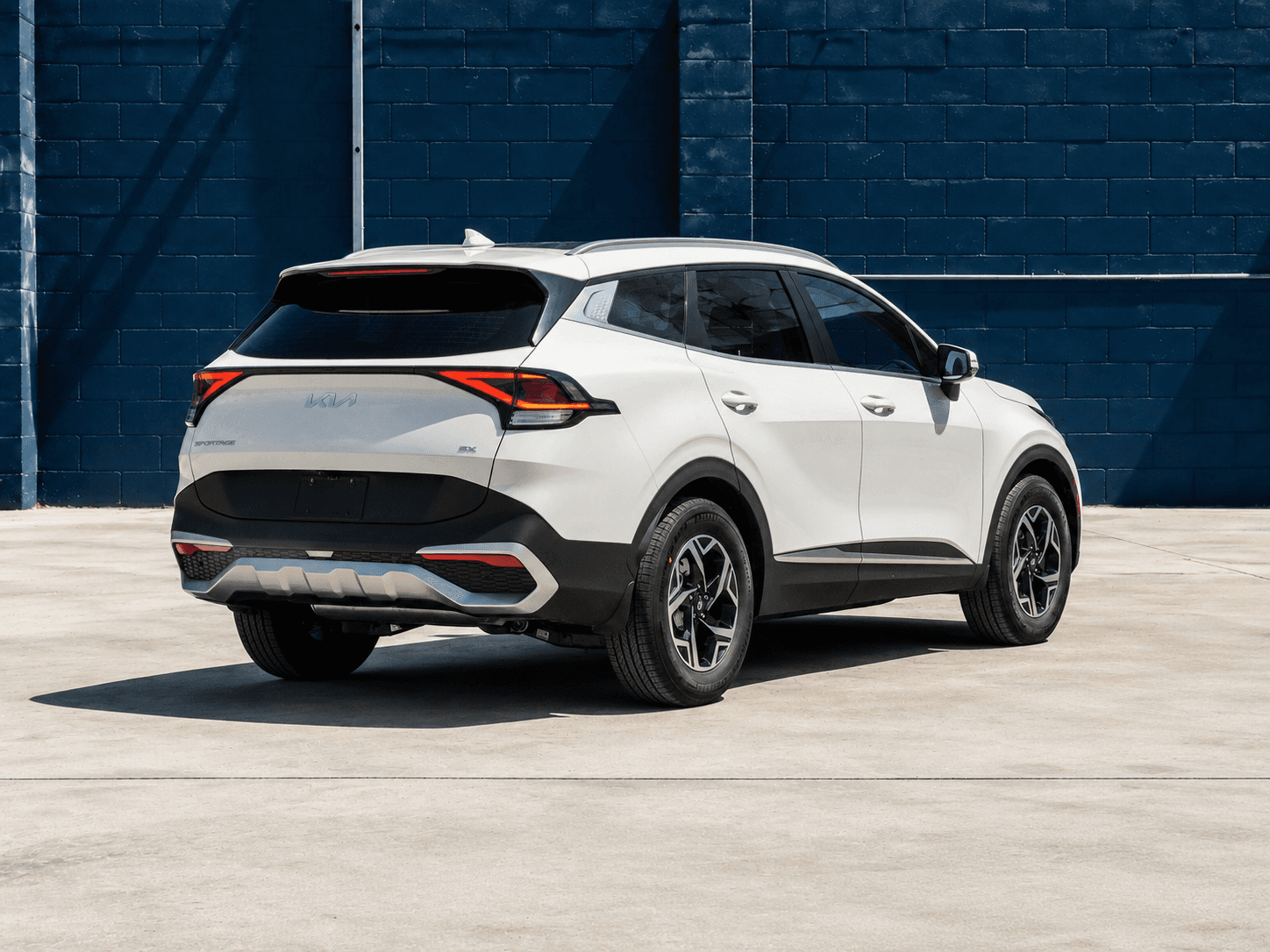 2023 Kia Sportage in White, rear three-quarter view