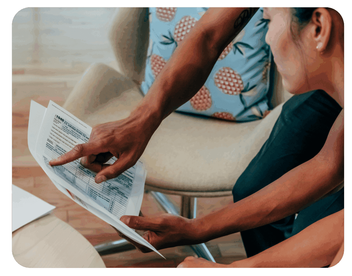 Two people reviewing a financial document together at home