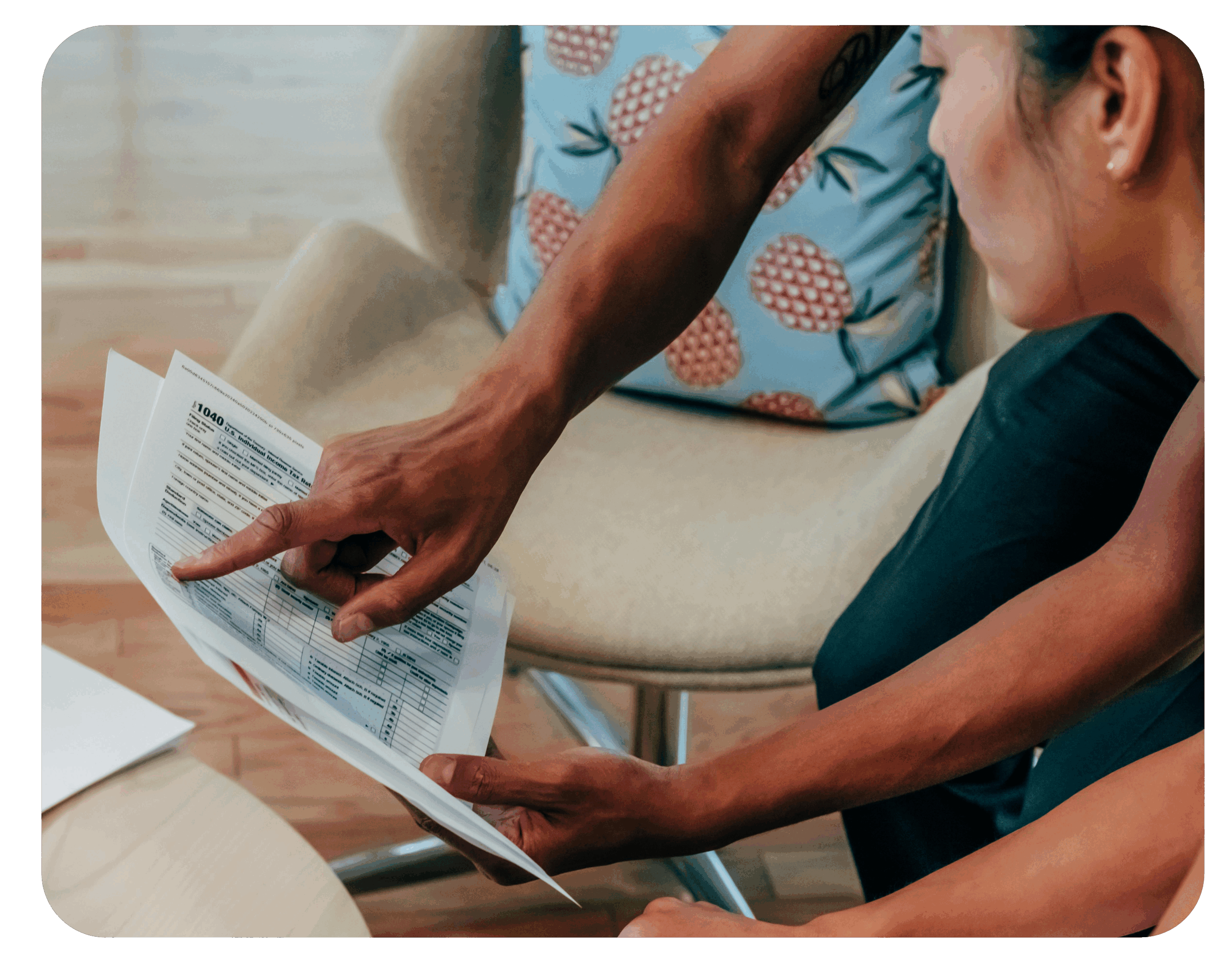two_people_looking_at_documents two people looking at documents scaled