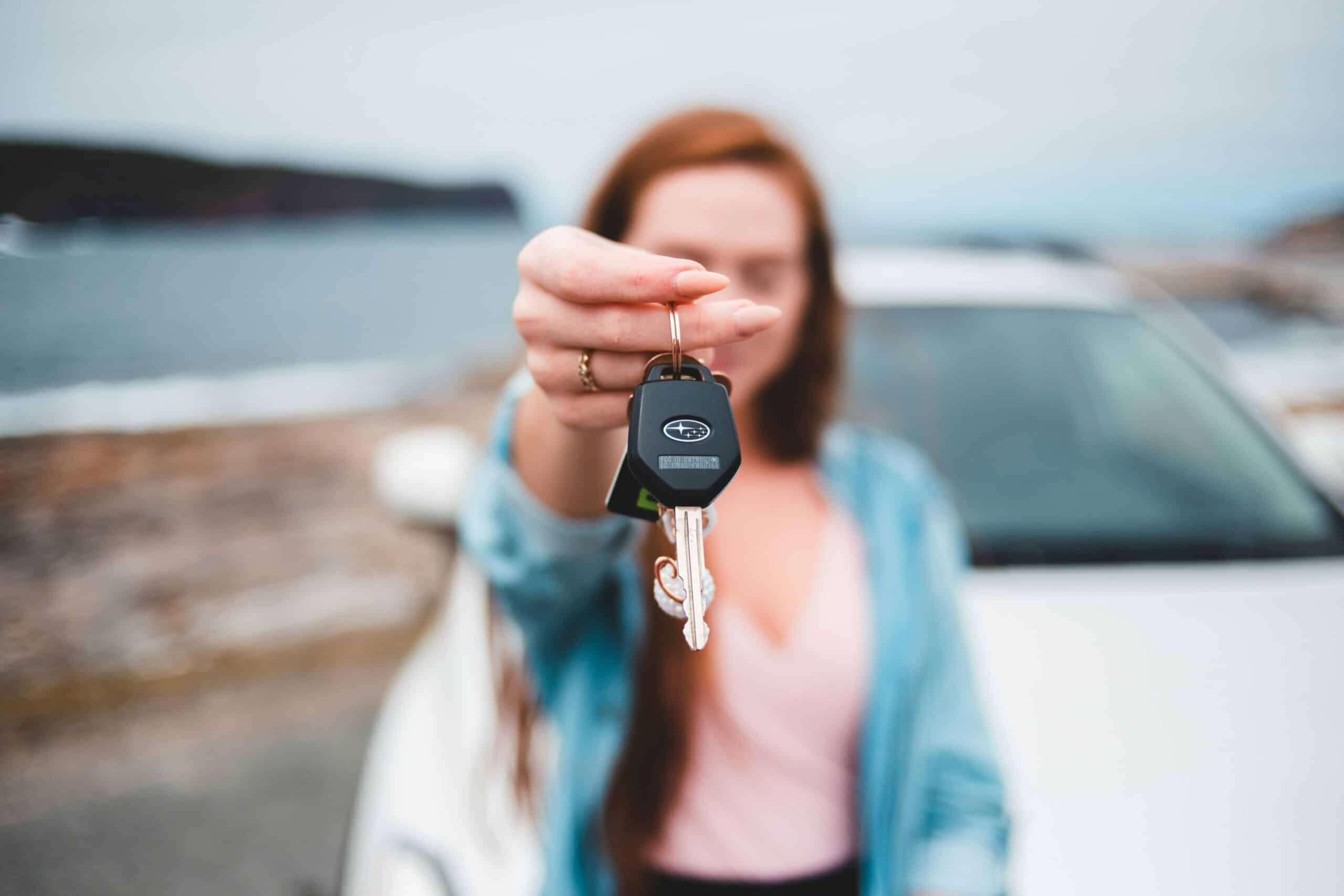 woman holding car keys scaled